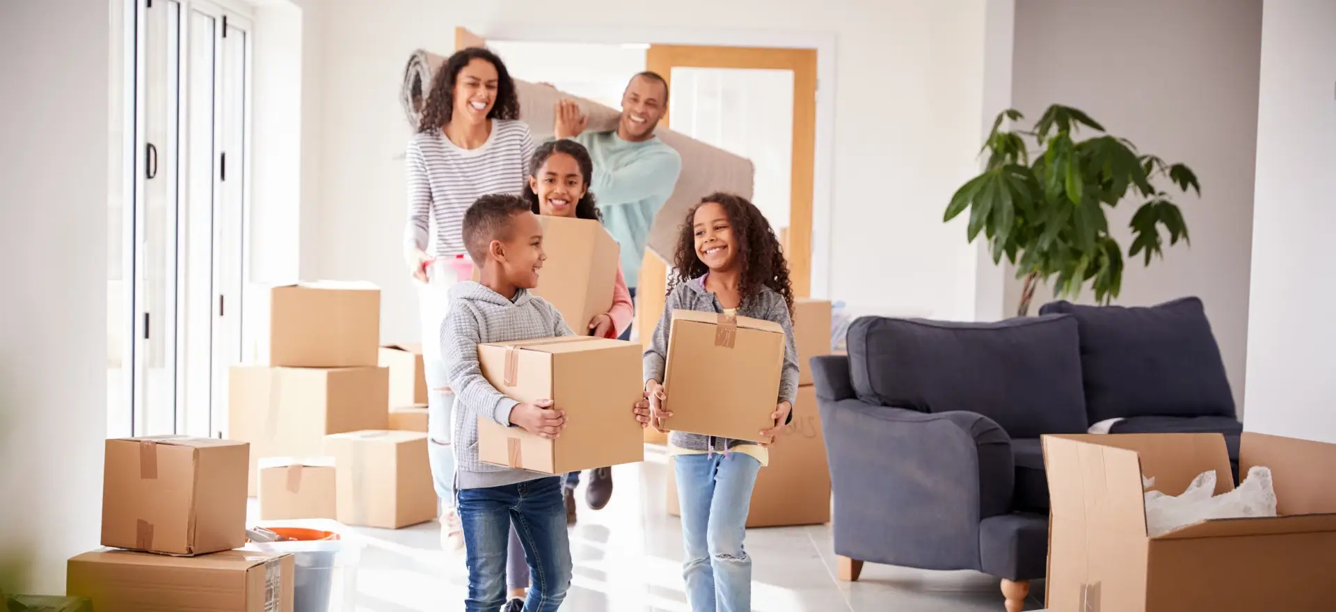 Happy family moving in to their new home thanks to Platinum One Financial, LLC